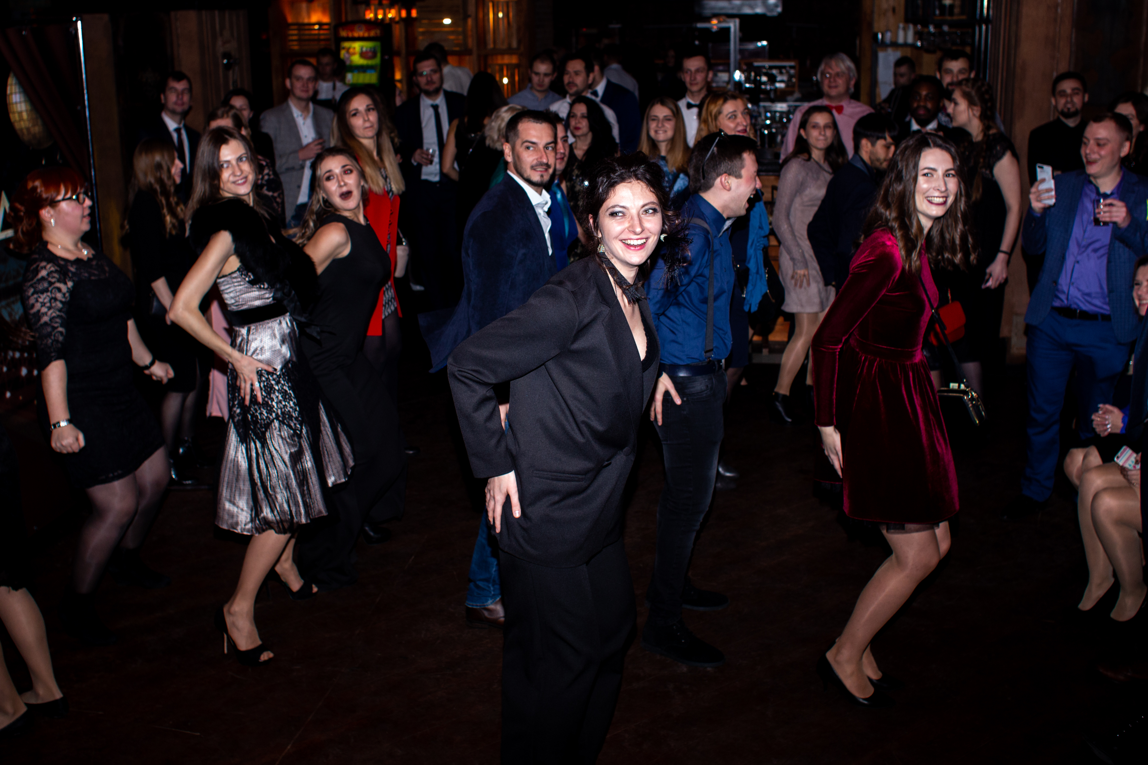 Yellow Stone colleagues dressed for a company celebration, gathered on a dance floor