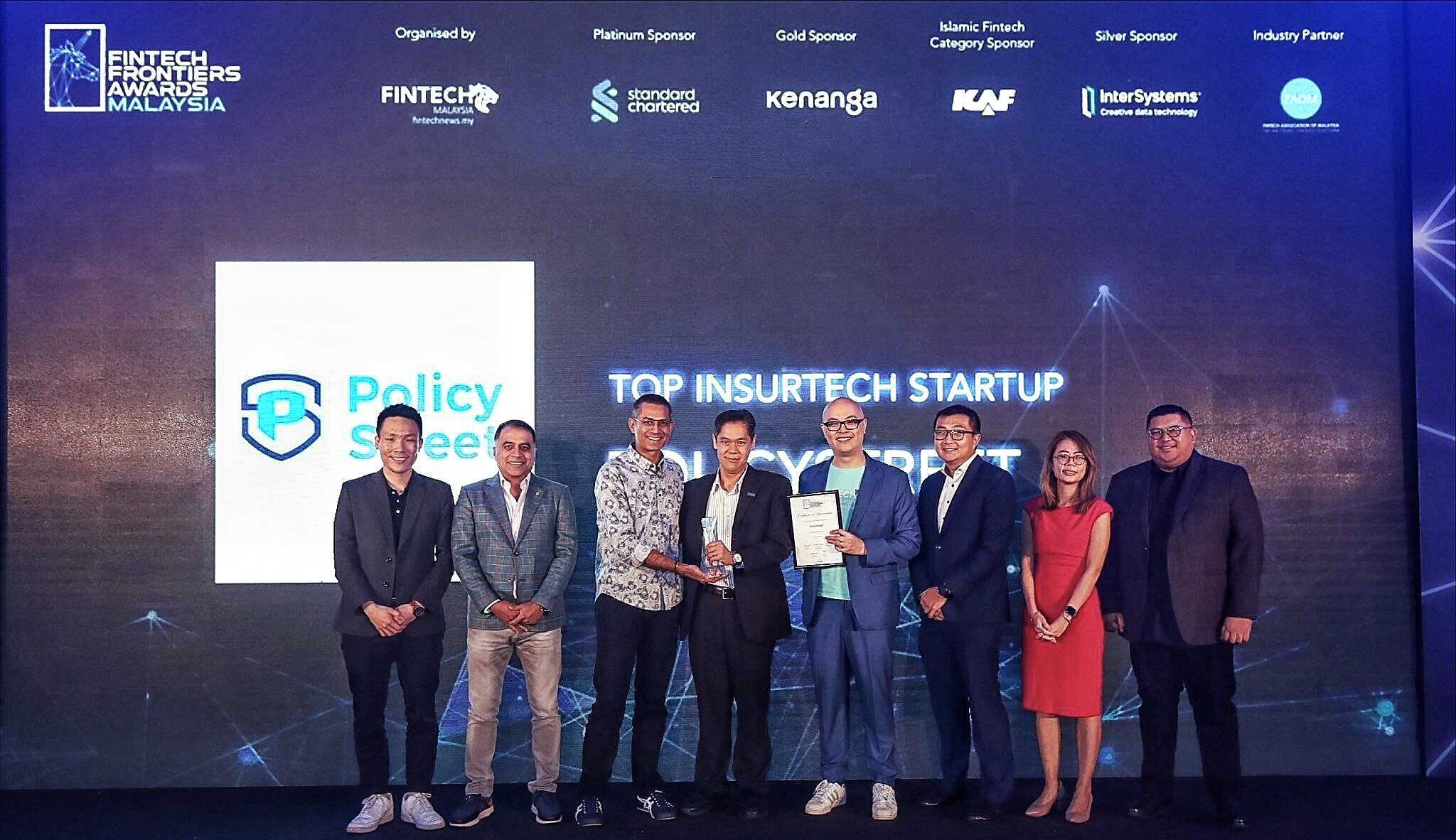 Yen Ming Lee, fourth from left, holding an award at the 2023 Fintech Frontiers Awards