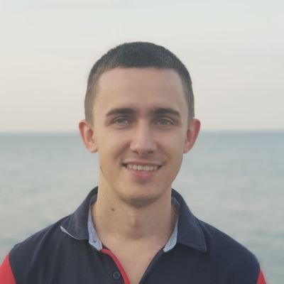 Yevgen Altynpara smiling outdoors beside the water, in the photograph accompanying his TopDevelopers interview