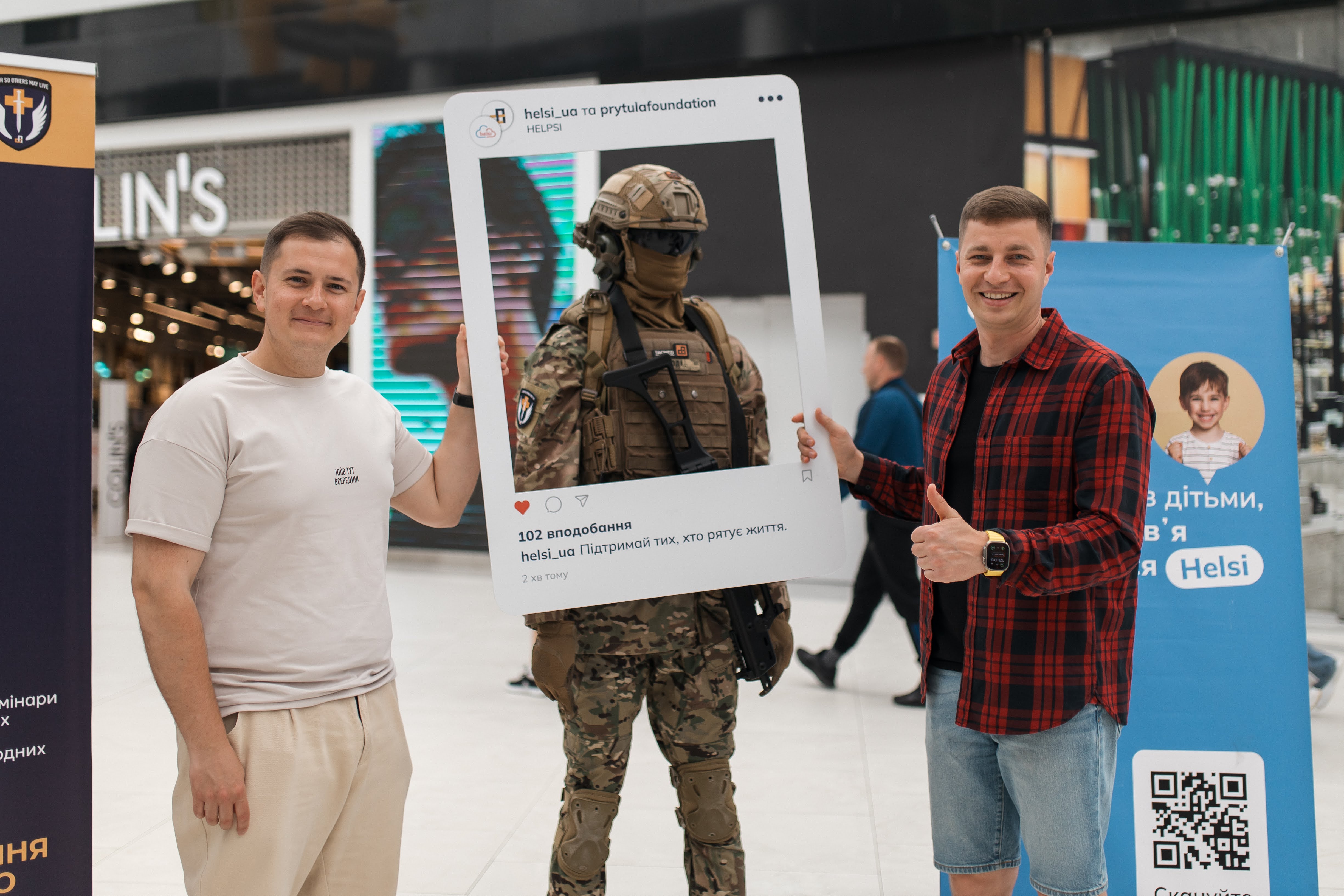 Yevhen Donets, right, in a red checked shirt at a HELSI event