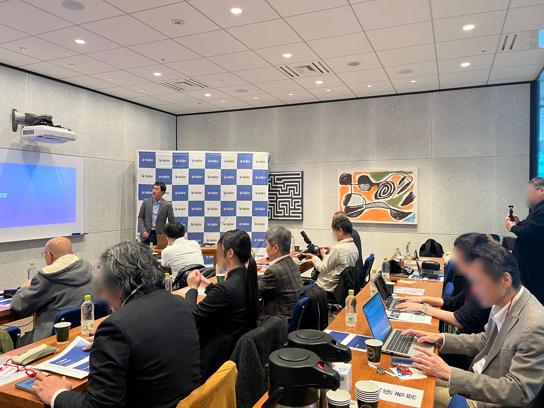 Yo Shibata presenting at Tailor's Omakase launch in Tokyo, with attendees seated at tables