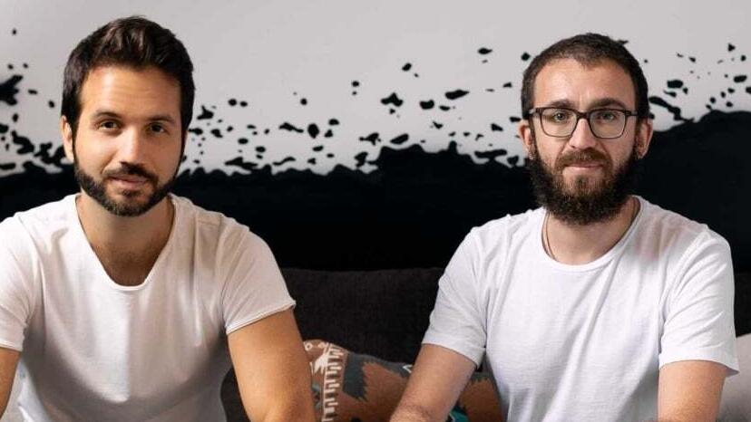 Yoav Vilner, left, seated beside Walnut co-founder Danni Friedland