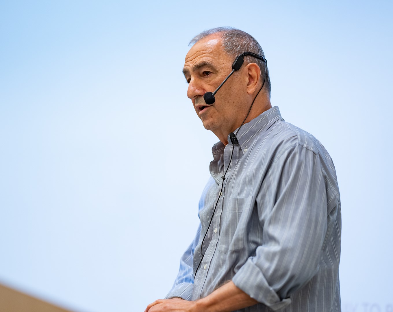 Yonatan Stern teaching while wearing a headset microphone