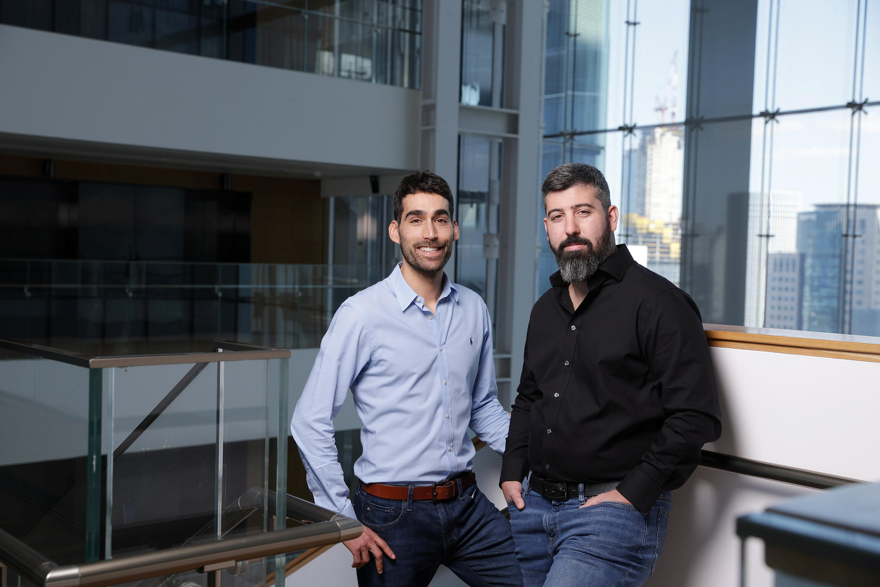 Yotam Segev, right, standing with Cyera co-founder Tamar Bar-Ilan in an office