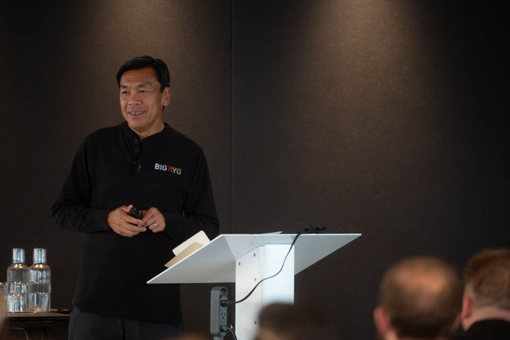 You Mon Tsang speaking at a lectern at BIG RYG 2023