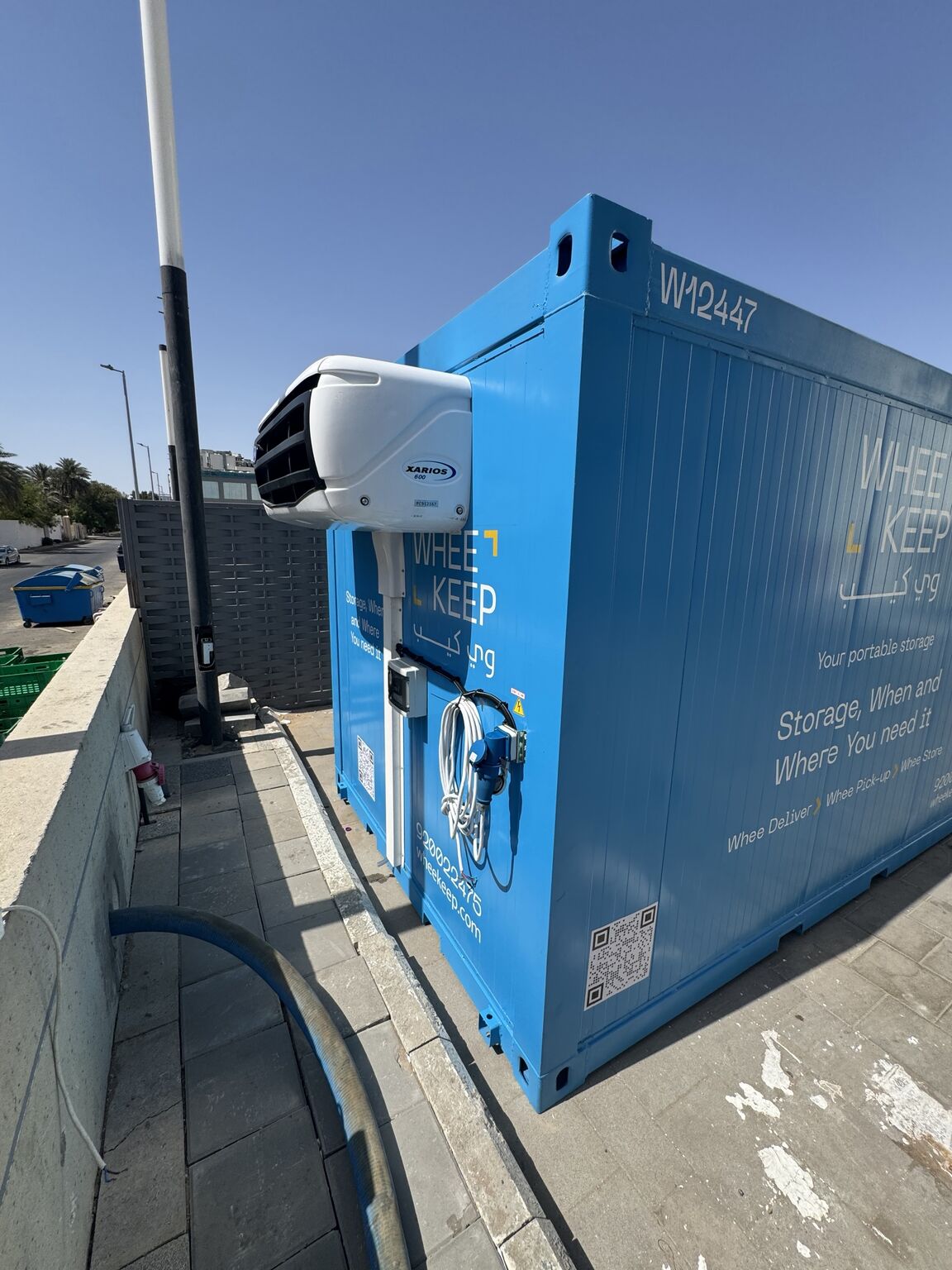 Blue WheeKeep storage unit with refrigeration equipment, photographed for Fayez’s manufacturing update