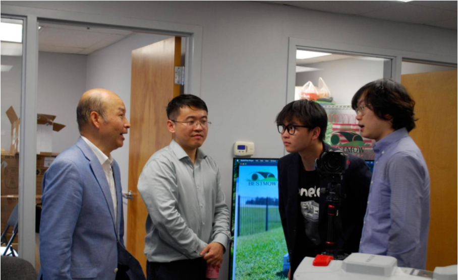 Yulai Weng, second from left, with visitors at BESTMOW’s Boston center opening