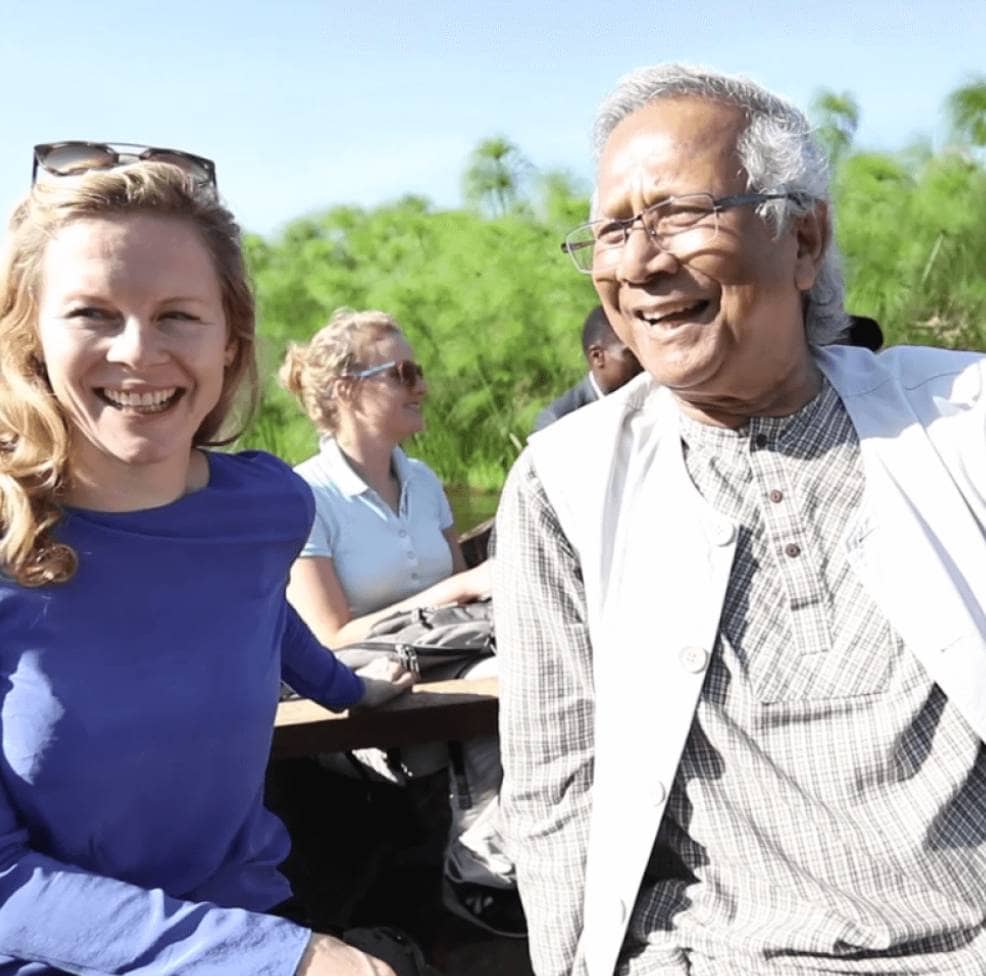 Yunus Social Business co-founders Saskia Bruysten and Muhammad Yunus smiling outdoors