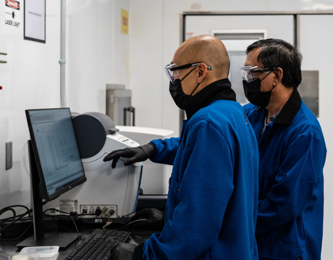 Blue Current scientists reviewing battery data in a laboratory