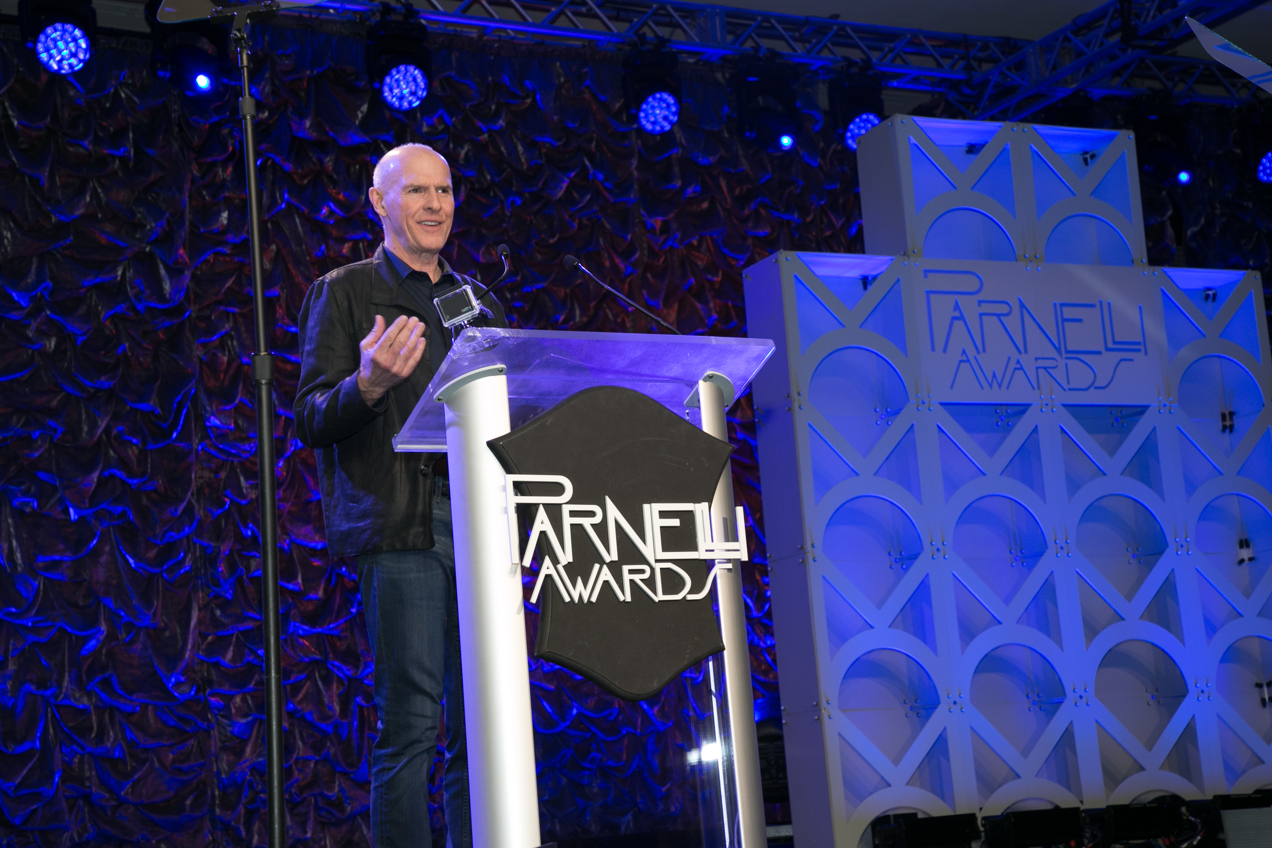 Yvan Miron speaking at the lectern during the 2019 Parnelli Awards