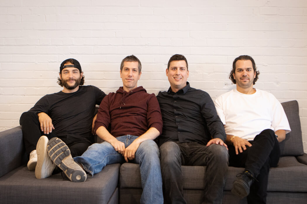 Four Deck founders seated together on a sofa, with Yves-Gabriel Leboeuf at the right