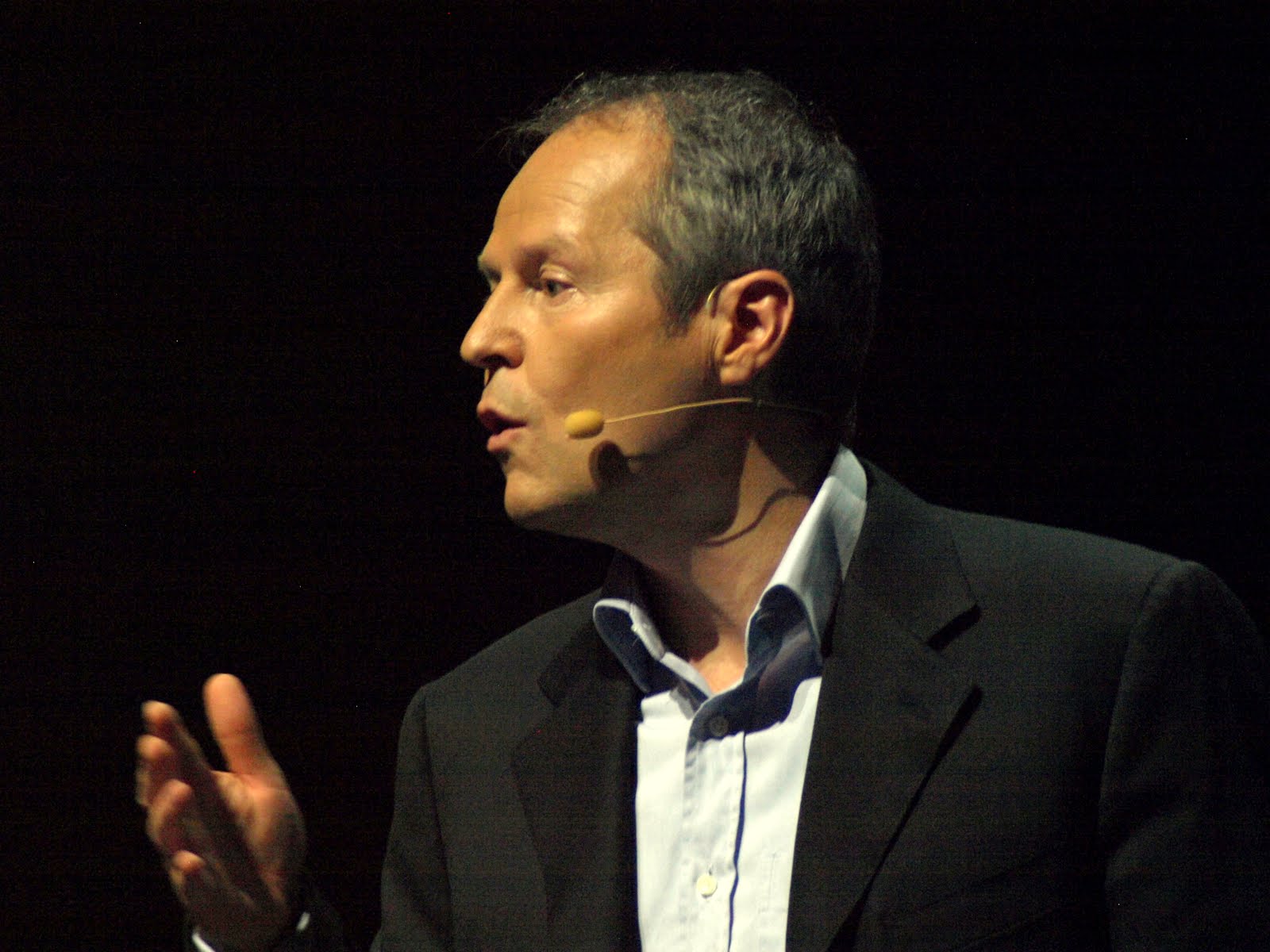 Yves Guillemot speaking with a headset microphone at E3 in Los Angeles in 2010