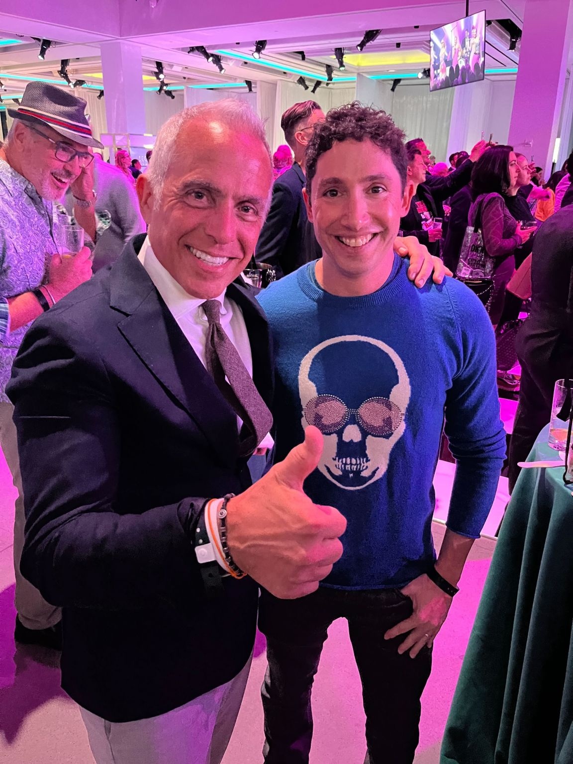 Geoffrey Zakarian and Zac Brandenberg smiling together at a City Harvest event