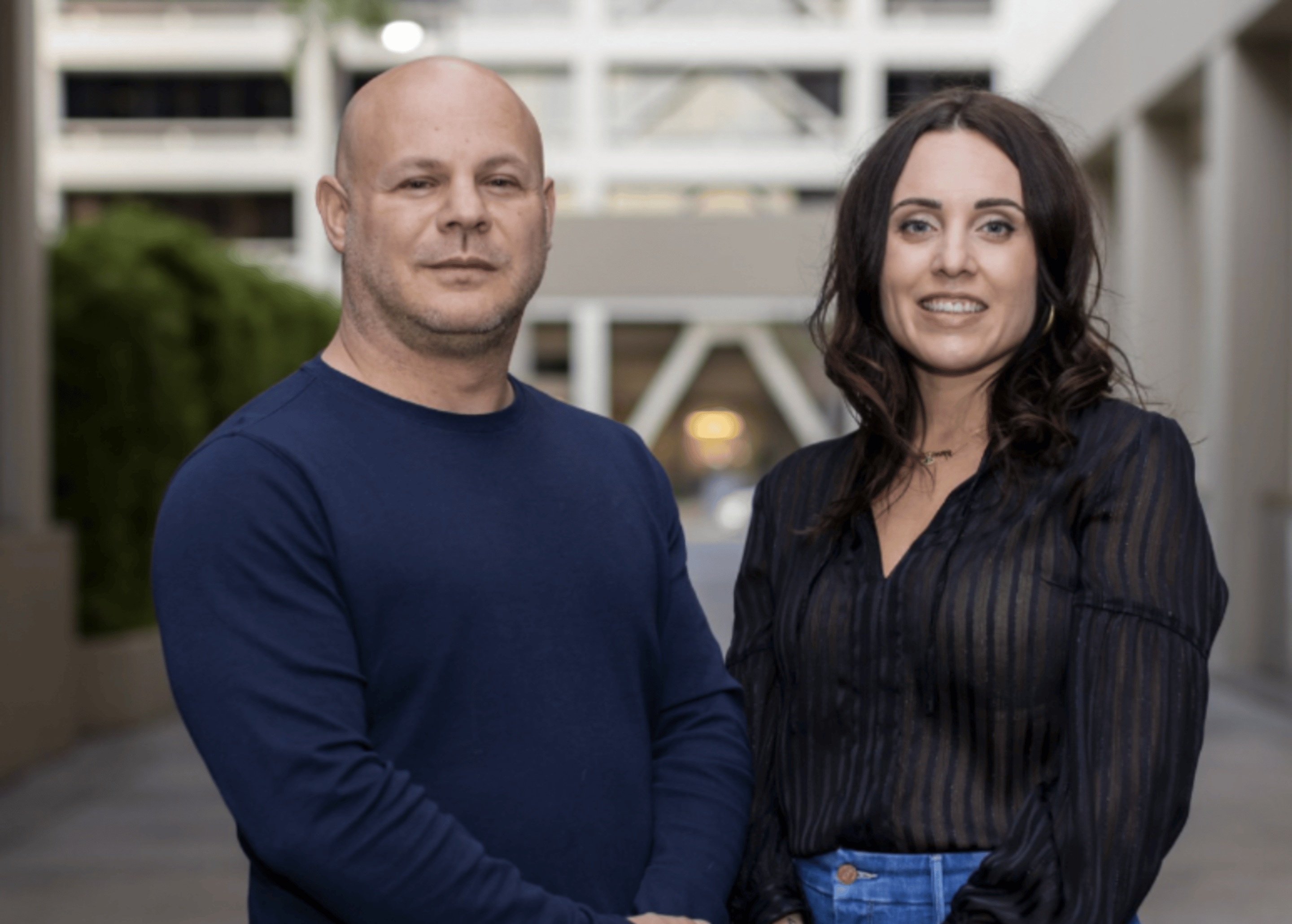 Zach Rosenfield, left, and Amanda Brocato standing together outdoors