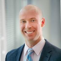 Zack Carpenter in a dark jacket and pale tie