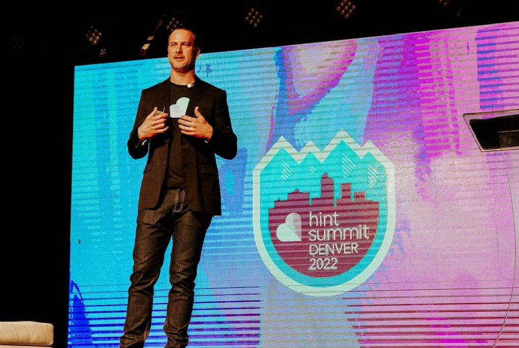 Zak Holdsworth presenting on stage at Hint Summit 2022 in Denver