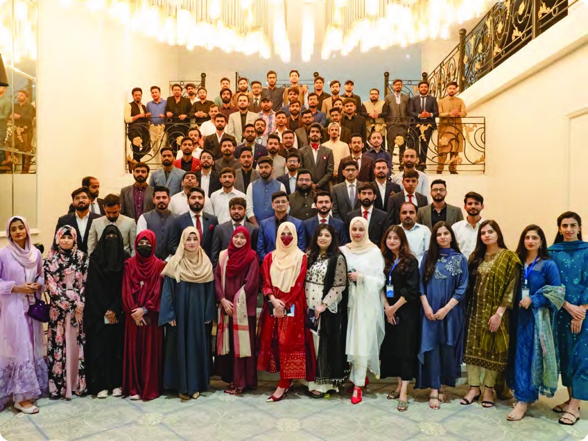 ZAPTA team posing together on a staircase at a company gathering