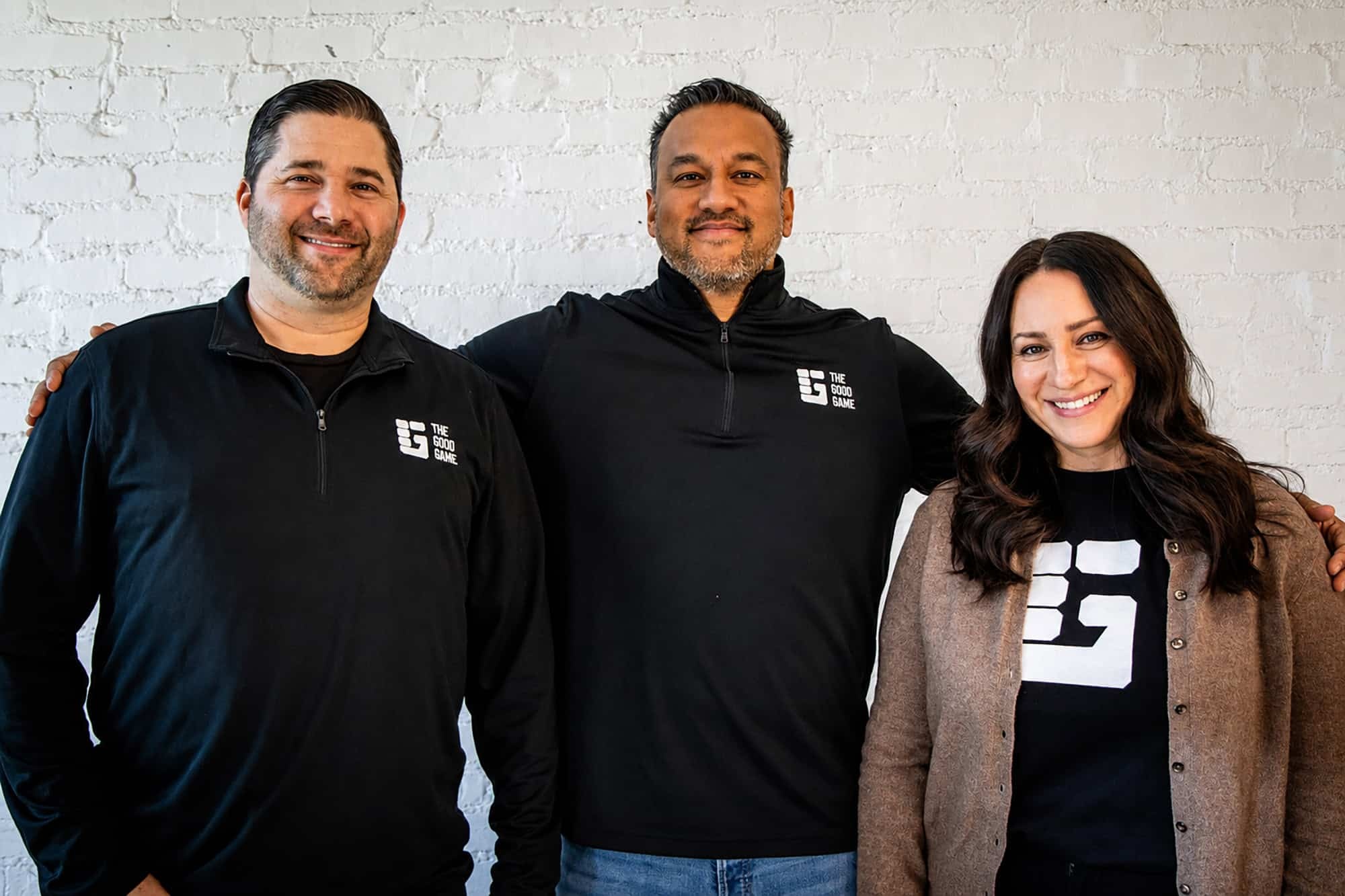 Ryan AufDerHeide, Zarif Haque and Nicole Burke standing together in The Good Game clothing