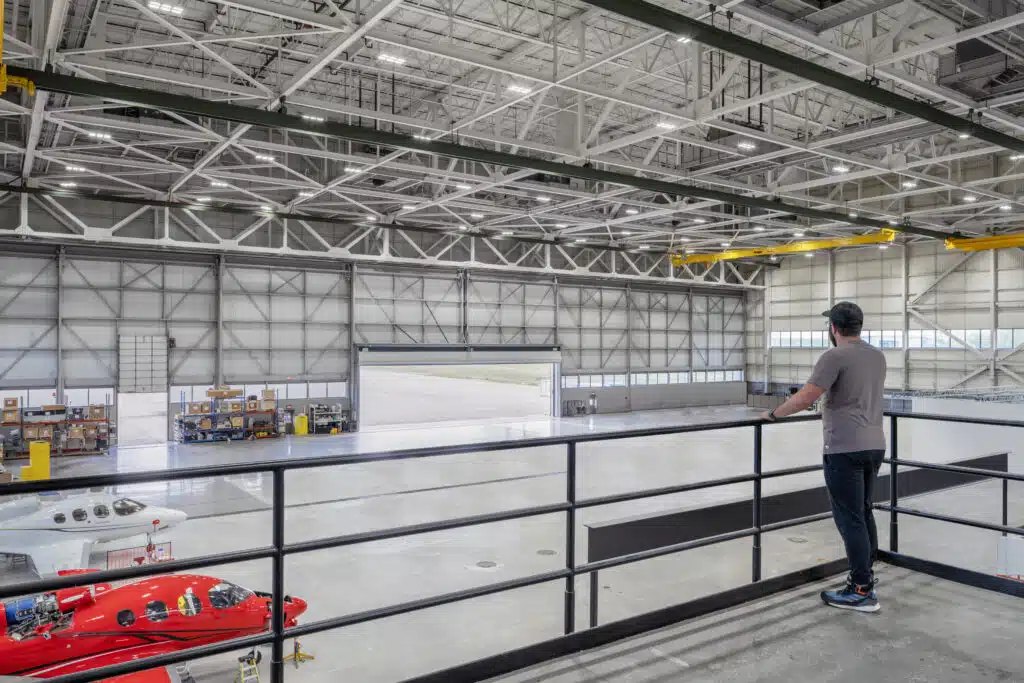 Aircraft and equipment inside the Cirrus Innovation Center hangar in Duluth
