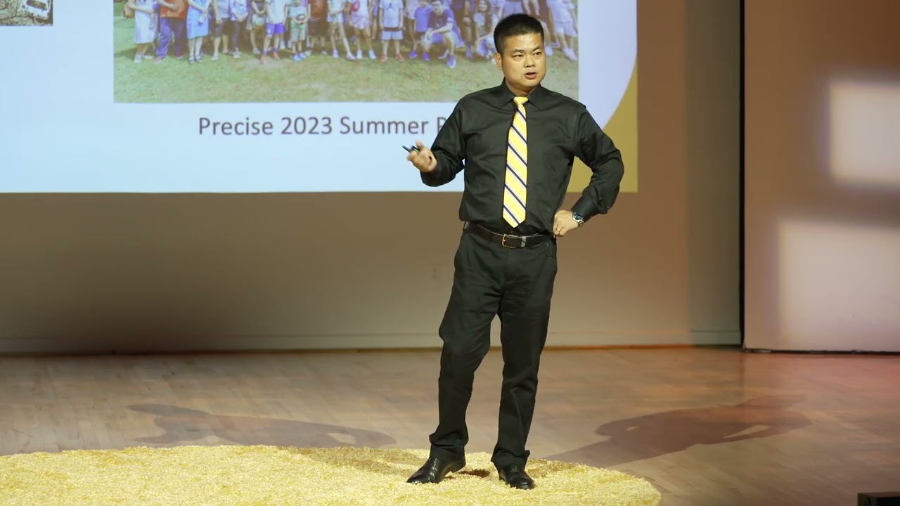 Zhensen Huang speaking on stage during UMBC's GRIT-X program