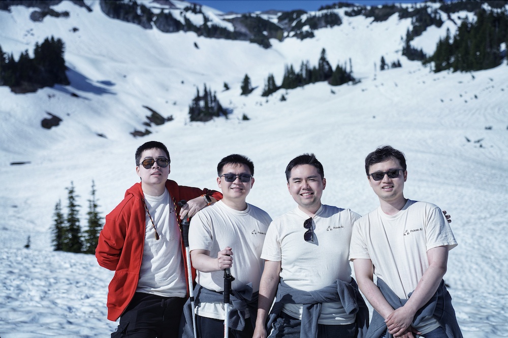 Michael Cai, Christopher Wu, Bill Zhu and Yi Wan standing together in snowy mountains