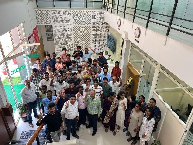 Group gathered in INDIC’s lobby for the implementation announcement