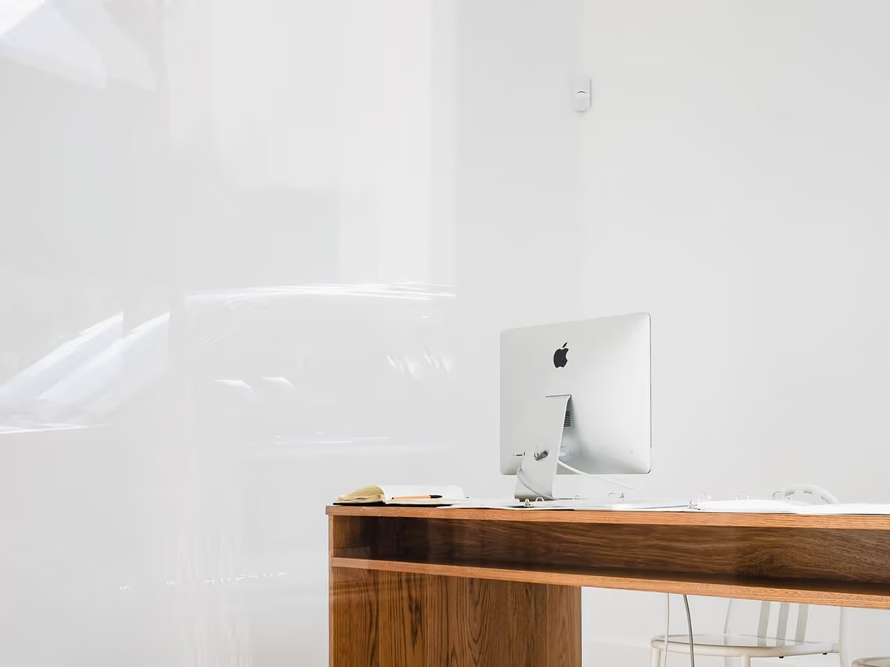 A desktop computer on a wooden desk, from Zip Security’s About page