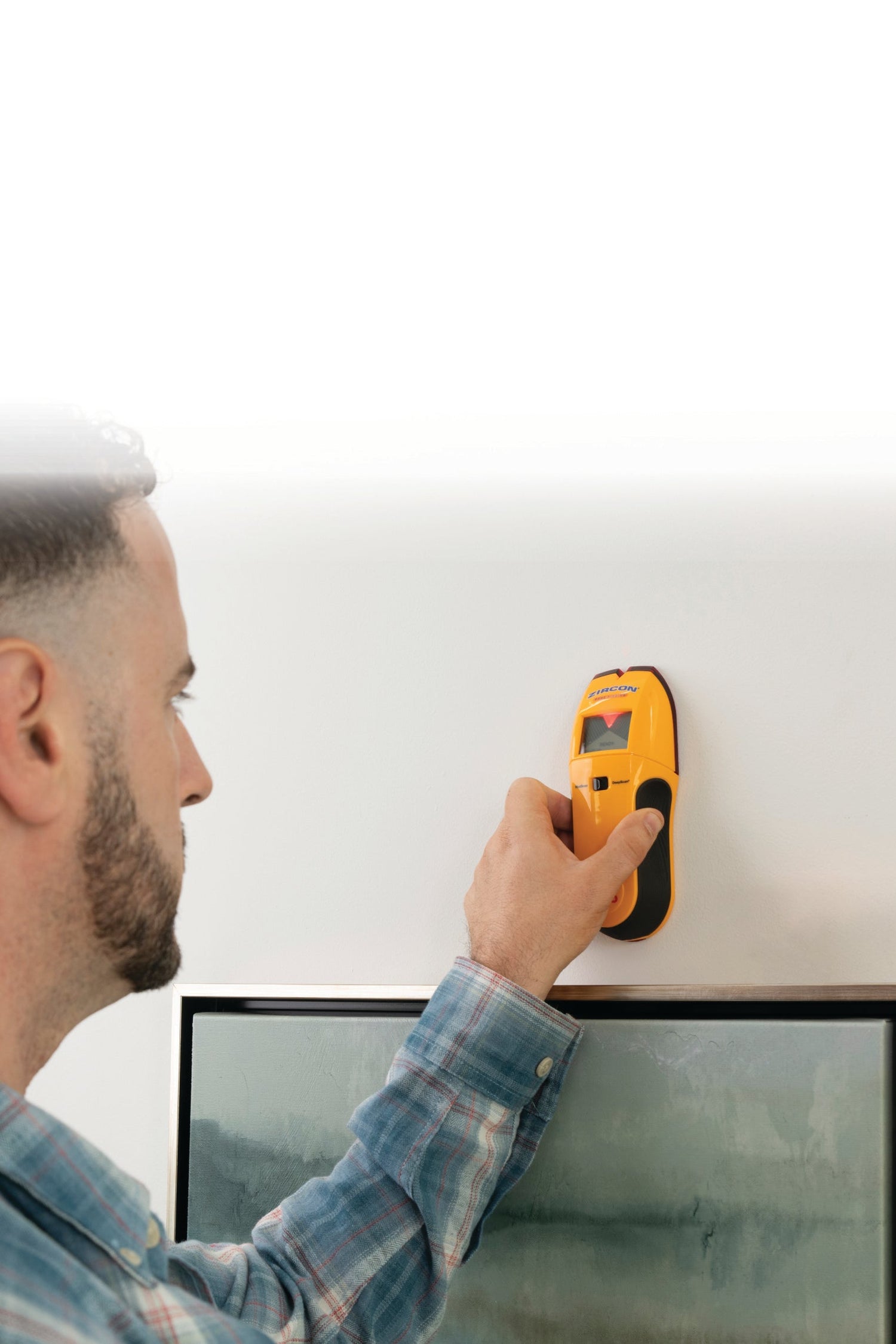 A Zircon stud sensor tool in a home-use setting