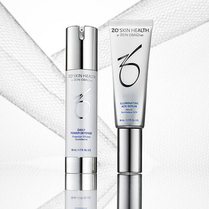 Daily Power Defense and Illuminating AOX Serum in silver and white packaging