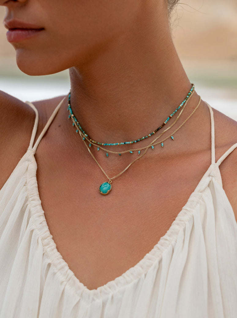 Zozi's 14k gold Dripping Gemstone Necklace with gemstone charms