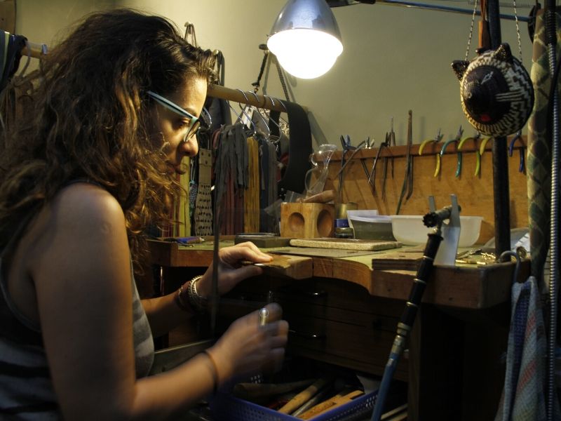 Zozi working at a jewelry bench in her Tel Aviv studio
