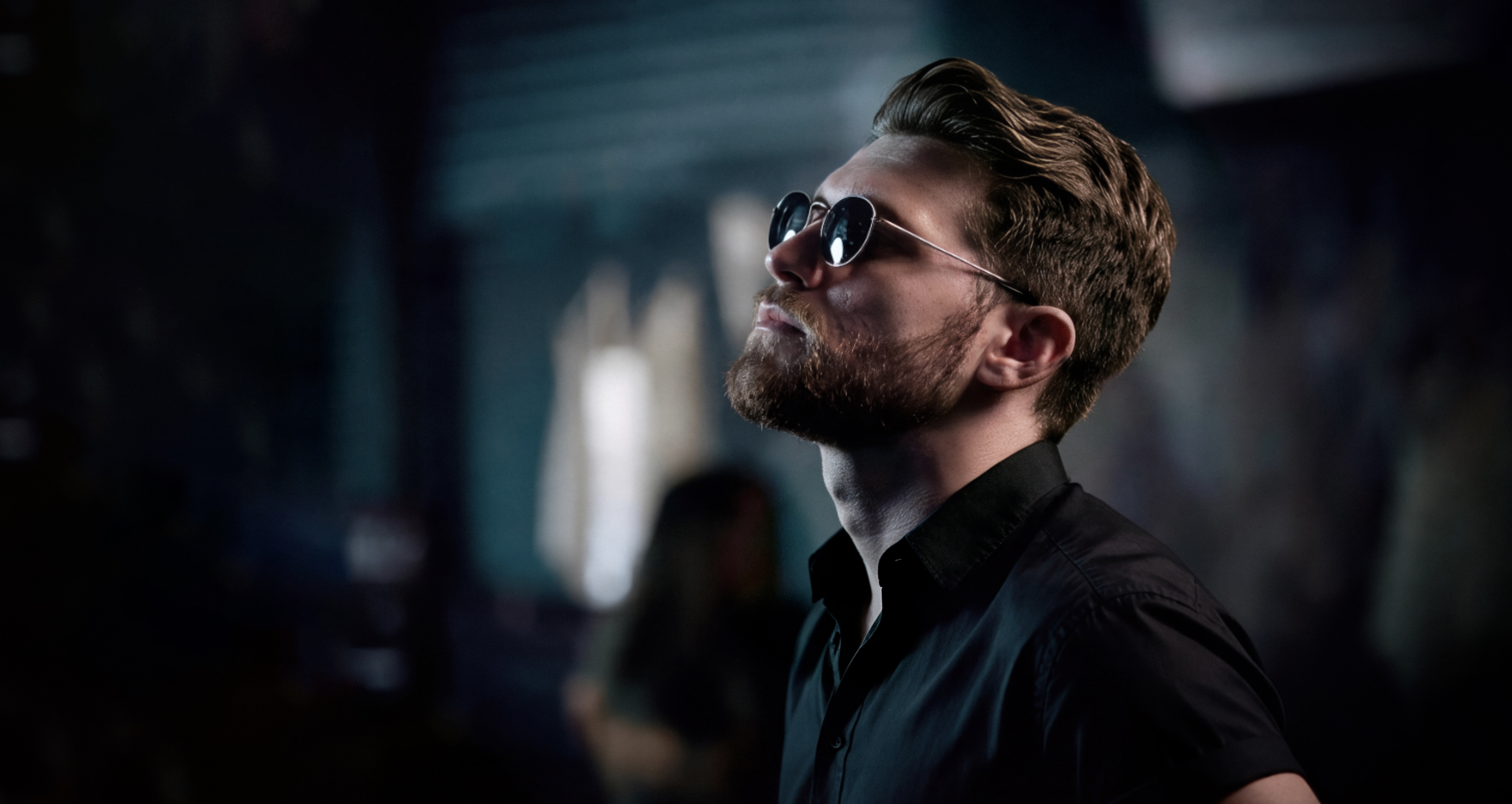 Matthew Sabia wearing sunglasses and a black shirt