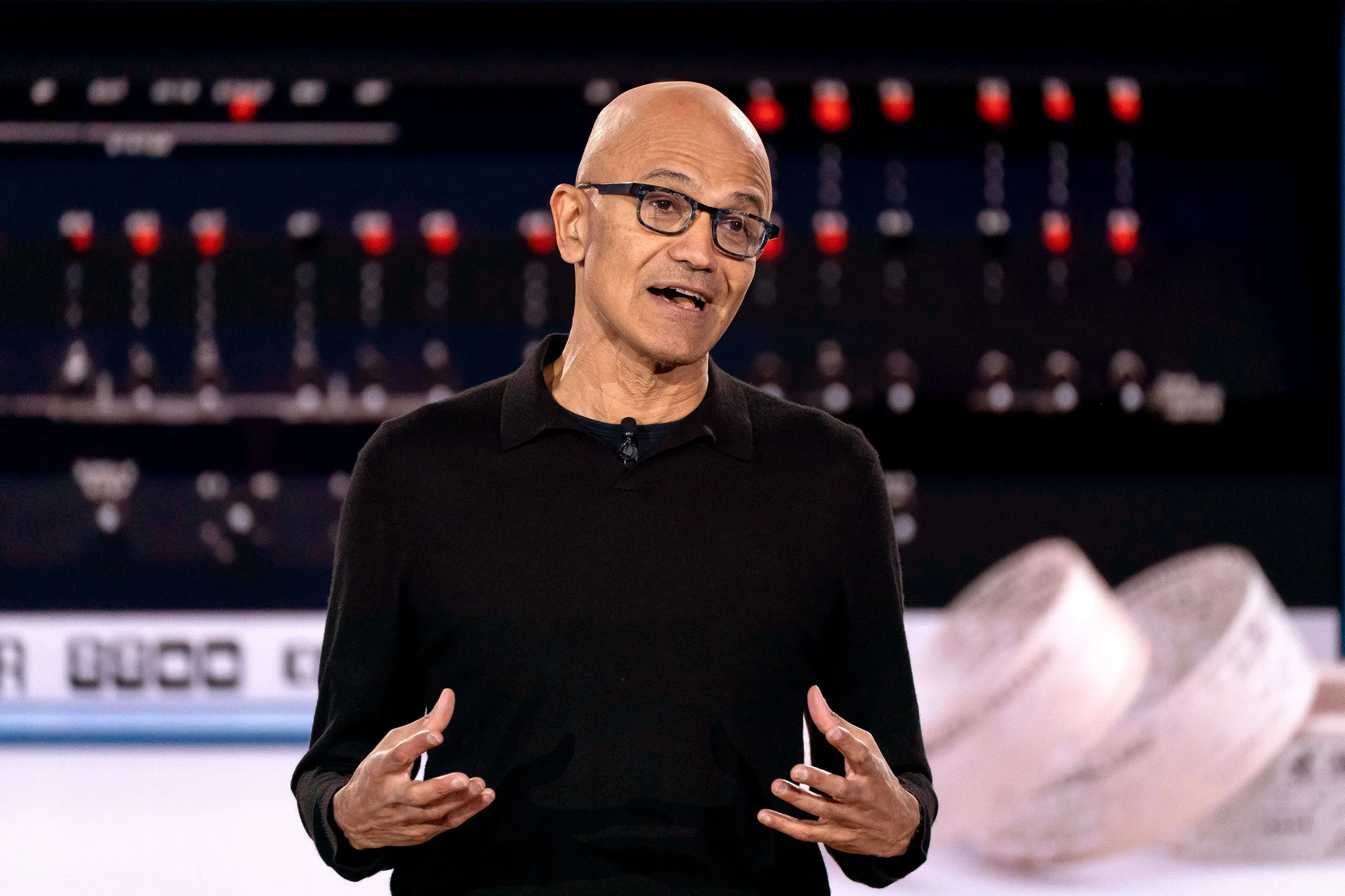 Satya Nadella at a Microsoft product launch event, showcasing AI innovation